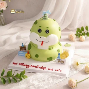 bánh kem hình con rắn màu xanh