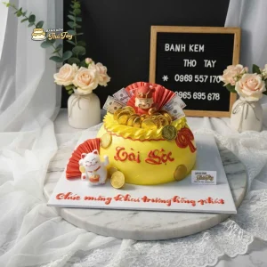 Bánh kem thần tài khai trương